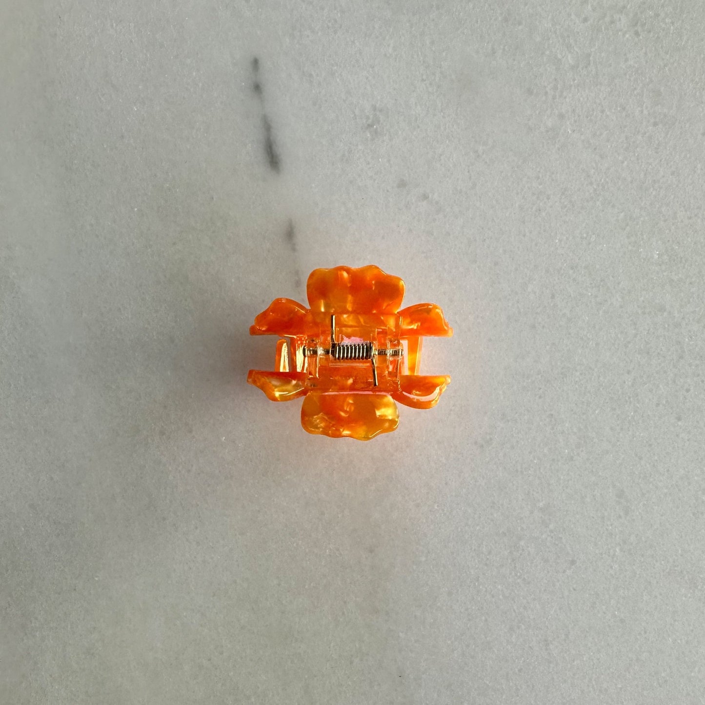 Marigold Hair Claw Clip - bittergoods - hinge of marigold clip flat on white marble background